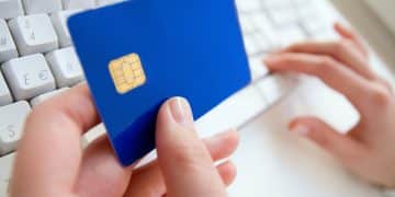 A person holding Chase Sapphire Preferred card.